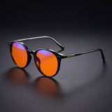 Raven Blue Light Glasses — Round Black Acetate, Amber Lenses