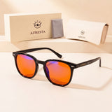 Rowan blue light glasses — glossy black panto TR90 frame with orange lenses, shown with the Auresta case and cloth